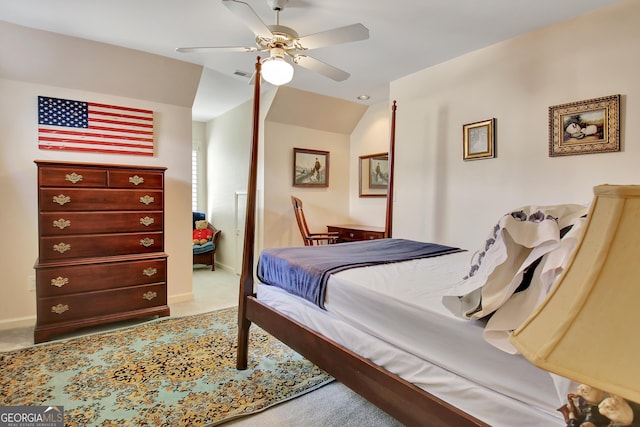 carpeted bedroom with ceiling fan and lofted ceiling