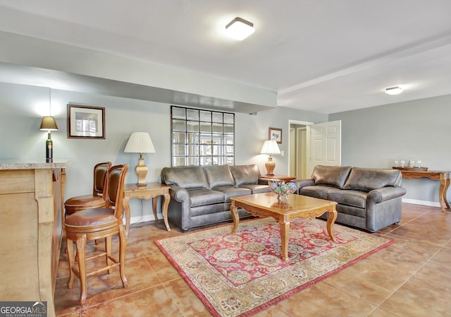 living room with tile patterned flooring