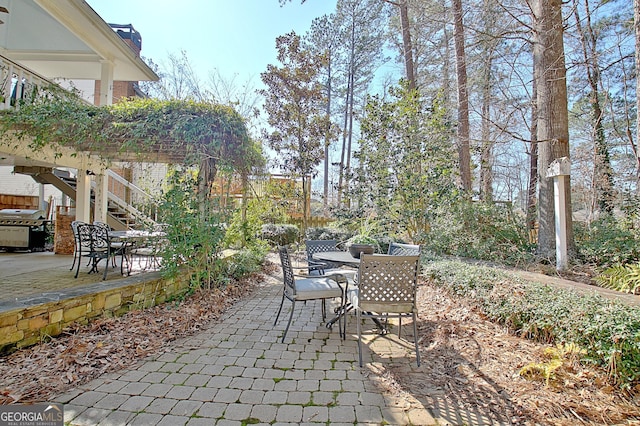 view of patio featuring a pergola and grilling area