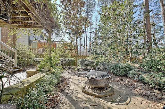 view of patio / terrace with a fire pit