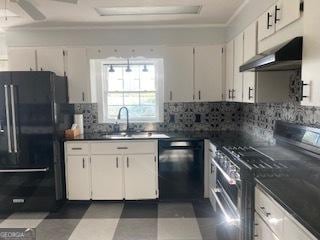 kitchen featuring tasteful backsplash, sink, white cabinets, ceiling fan, and black appliances