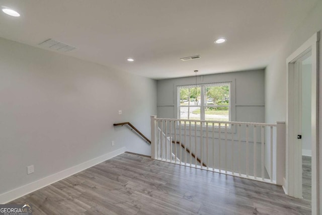 unfurnished room featuring light hardwood / wood-style flooring