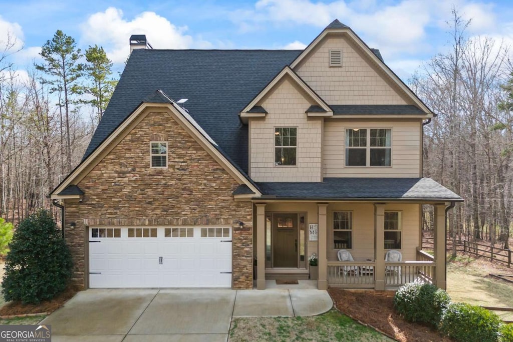 craftsman house featuring a garage and covered porch