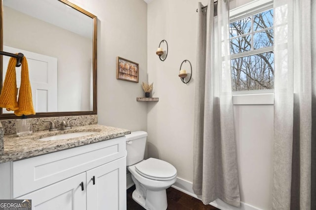 bathroom with vanity and toilet