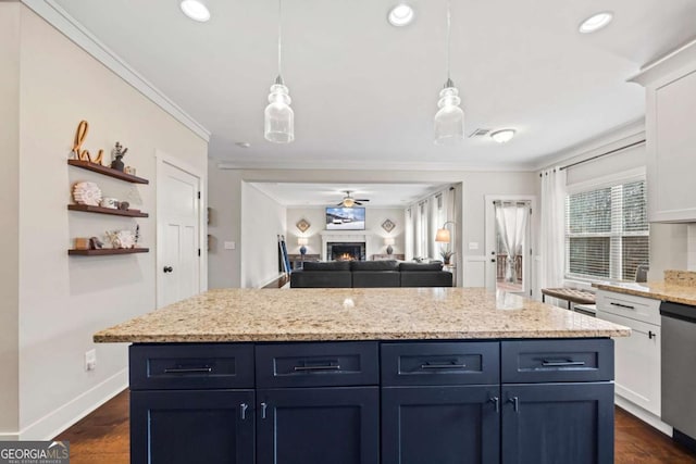 kitchen featuring white cabinetry, decorative light fixtures, crown molding, and dishwasher