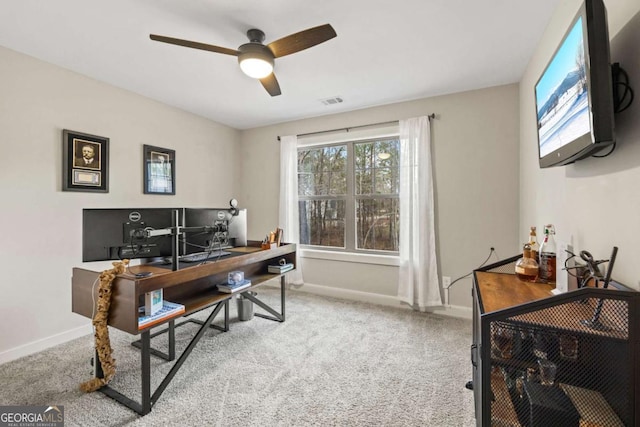 carpeted office with ceiling fan