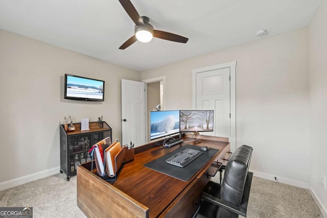 office space with light carpet and ceiling fan