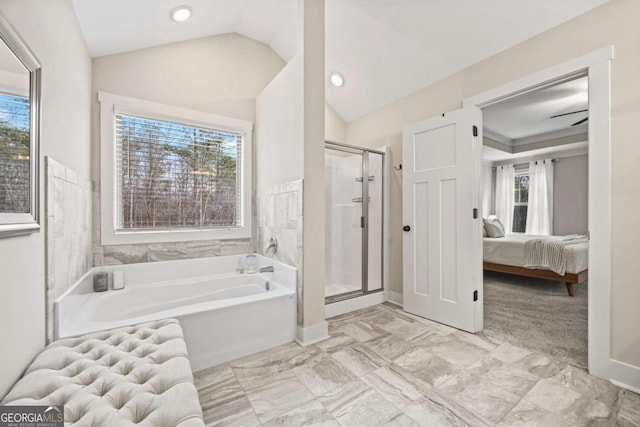 bathroom with lofted ceiling and plus walk in shower