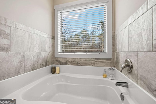 bathroom with a tub