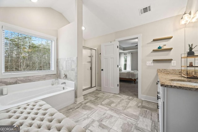 bathroom with lofted ceiling, radiator, separate shower and tub, and plenty of natural light