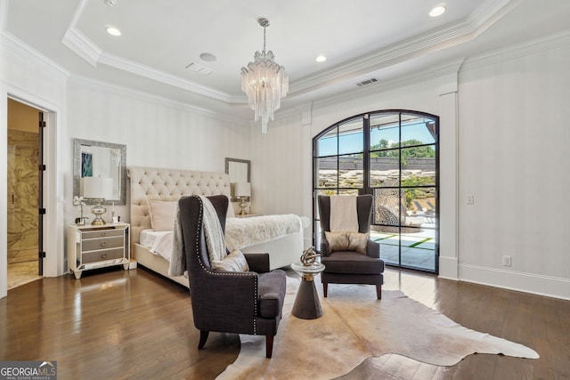 bedroom with visible vents, dark wood-style flooring, access to outside, a tray ceiling, and a notable chandelier