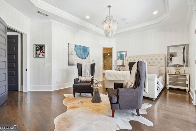 bedroom featuring dark wood-style floors, visible vents, crown molding, and an inviting chandelier