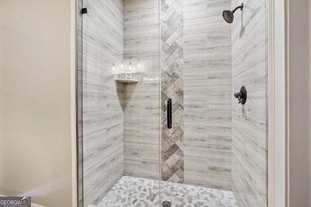 bathroom with a shower stall