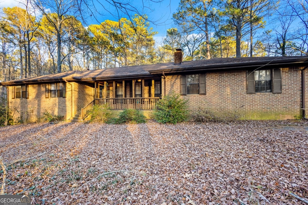 ranch-style home with covered porch