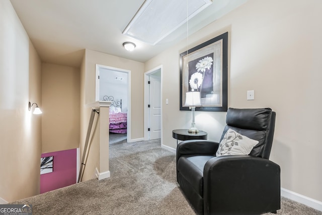 living area featuring light carpet