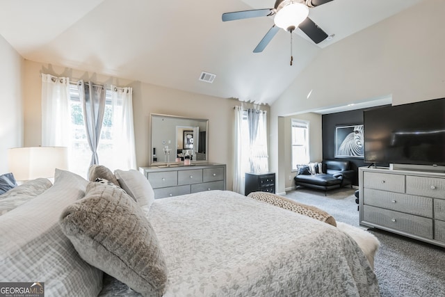 carpeted bedroom featuring multiple windows, high vaulted ceiling, and ceiling fan