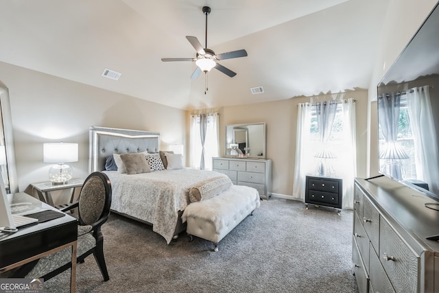 bedroom with lofted ceiling, dark carpet, and ceiling fan