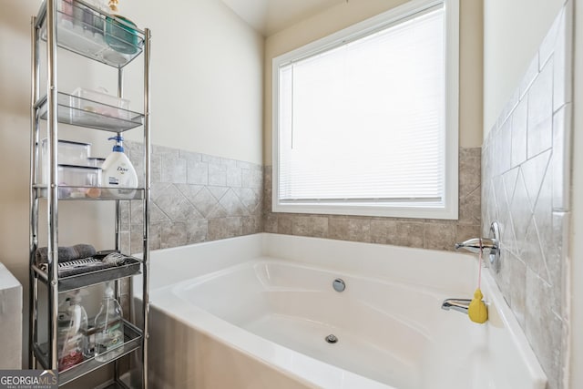 bathroom with a tub to relax in