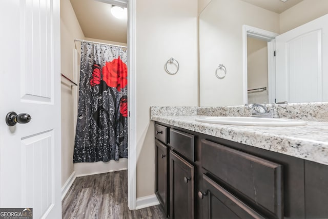 bathroom with vanity and hardwood / wood-style floors