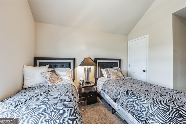 carpeted bedroom with vaulted ceiling