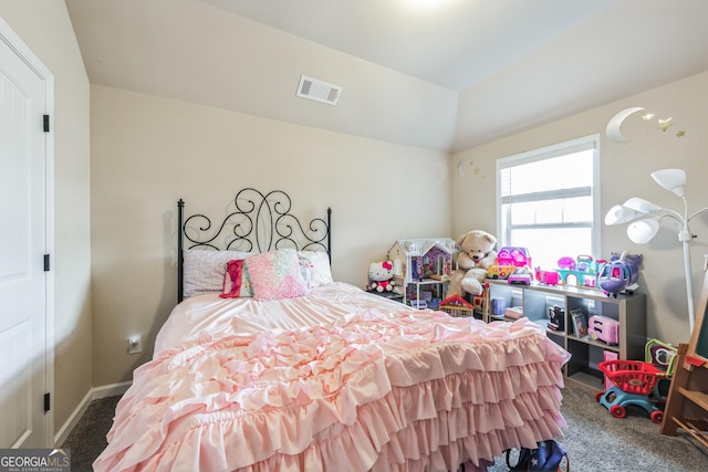 bedroom with vaulted ceiling and carpet floors