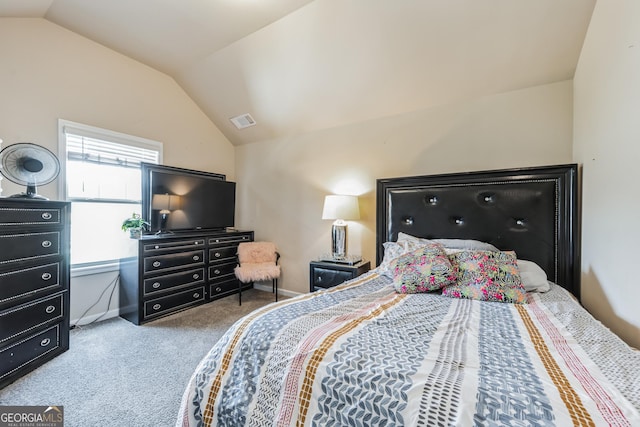 carpeted bedroom featuring vaulted ceiling