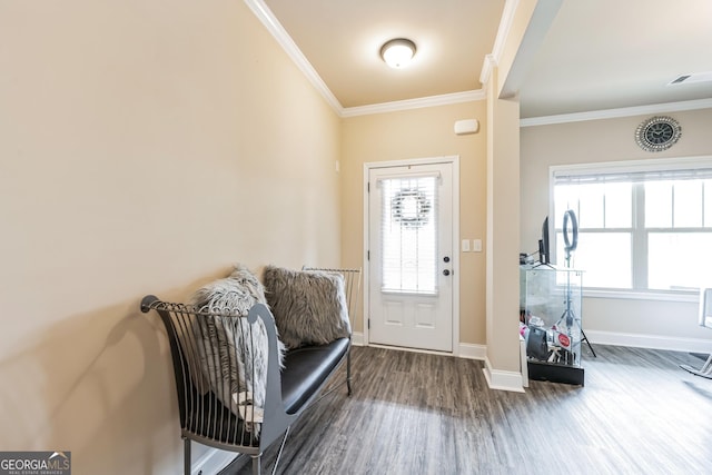 entrance foyer with crown molding and hardwood / wood-style floors