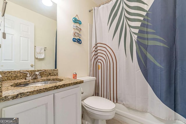 full bathroom featuring vanity, shower / bath combination with curtain, and toilet