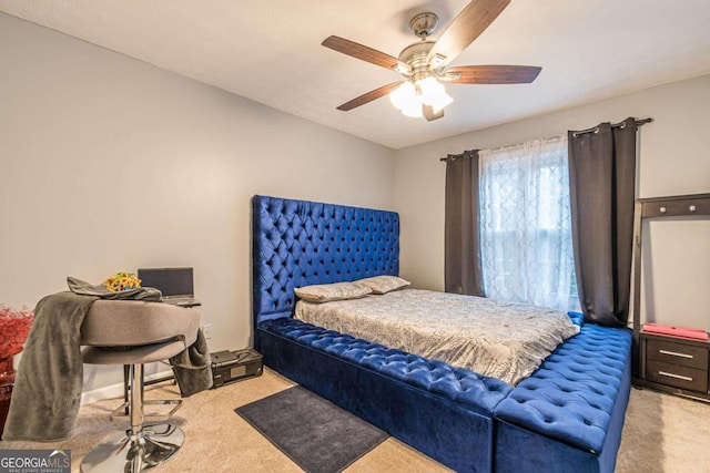 bedroom with ceiling fan and light carpet