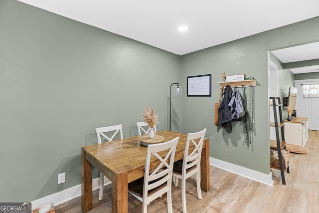 dining space featuring light wood-type flooring