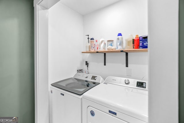 laundry room with independent washer and dryer