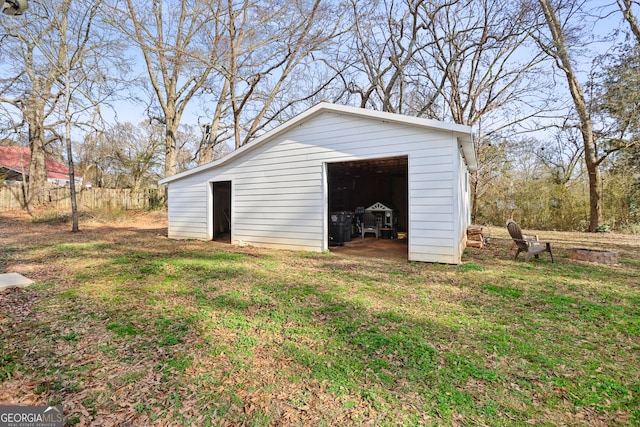 view of outdoor structure featuring a lawn