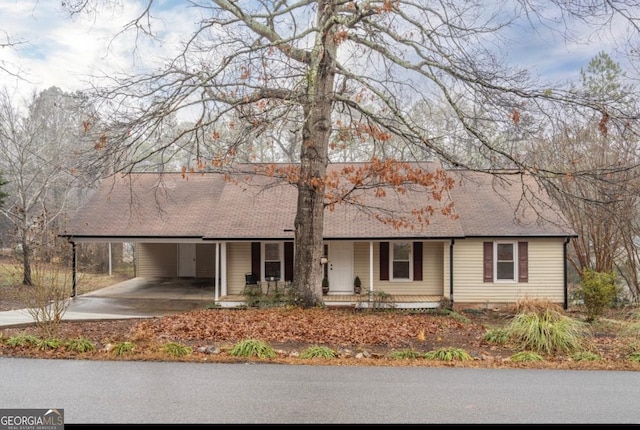 single story home featuring a carport