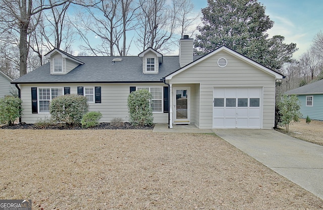 view of front facade with a garage and a front lawn