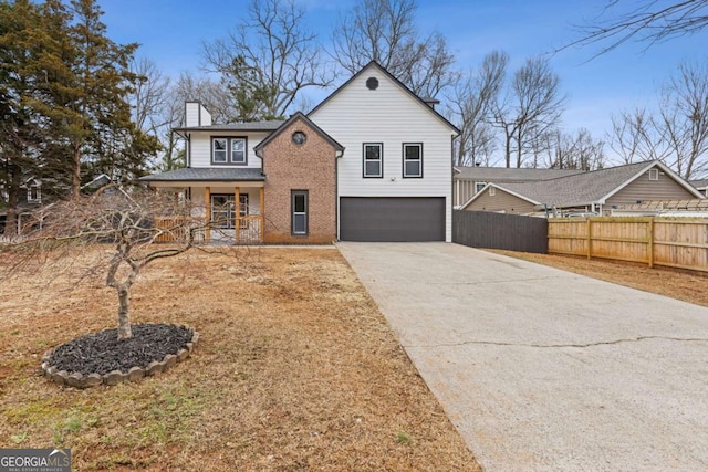 view of front property featuring a garage and covered porch