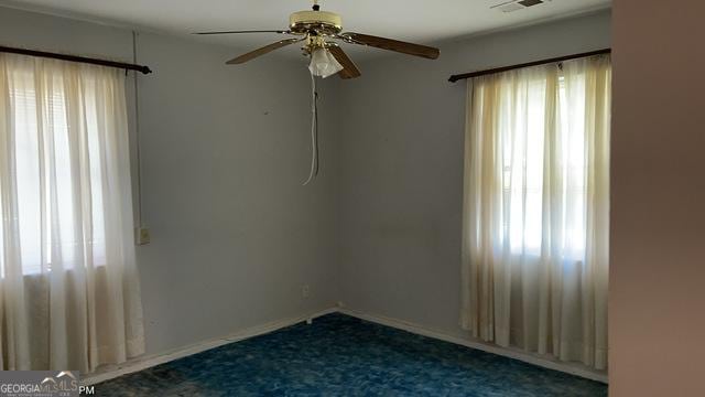 empty room featuring ceiling fan