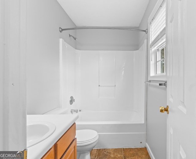 full bathroom featuring vanity, bathing tub / shower combination, and toilet