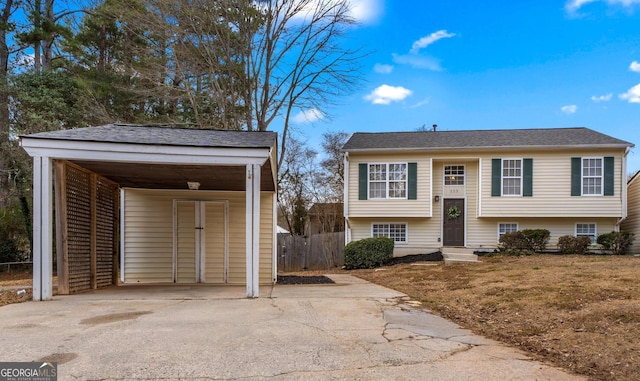 bi-level home featuring a carport