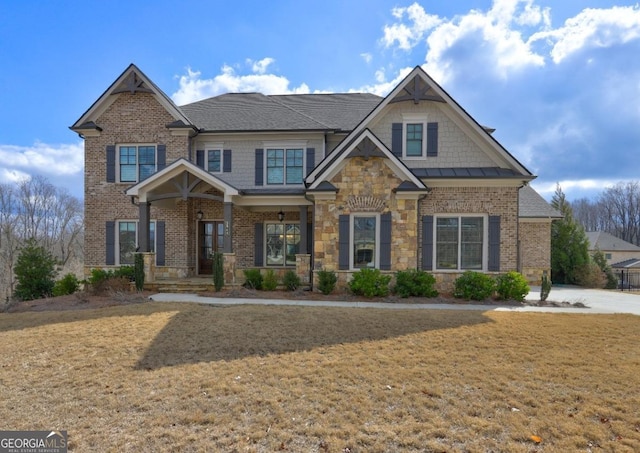 craftsman-style house with a porch and a front lawn