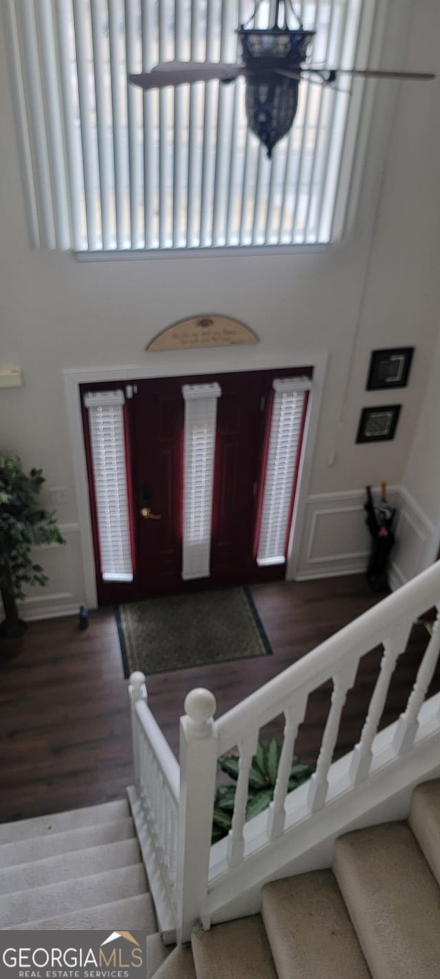 entrance foyer with an inviting chandelier and hardwood / wood-style floors