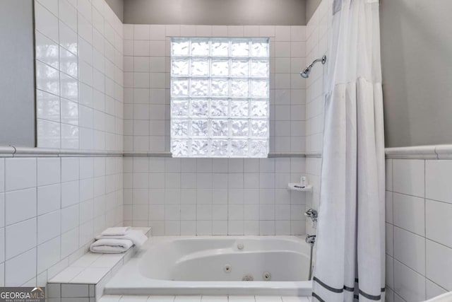 bathroom with plus walk in shower and tile walls