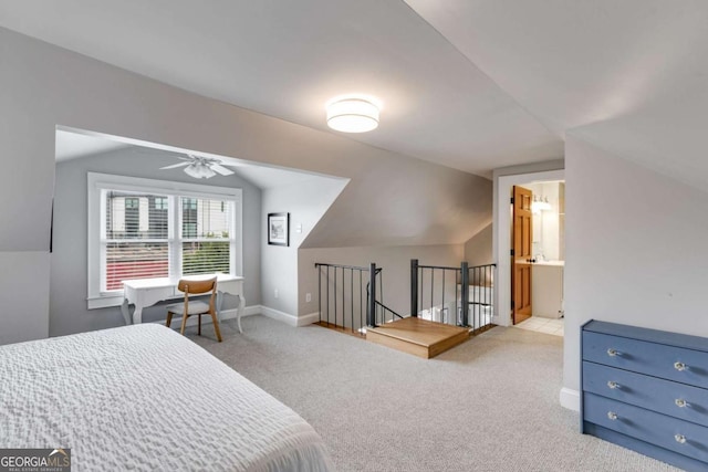 bedroom featuring light carpet and vaulted ceiling