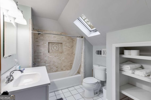 full bathroom with lofted ceiling with skylight, shower / bath combination with curtain, vanity, toilet, and tile patterned floors