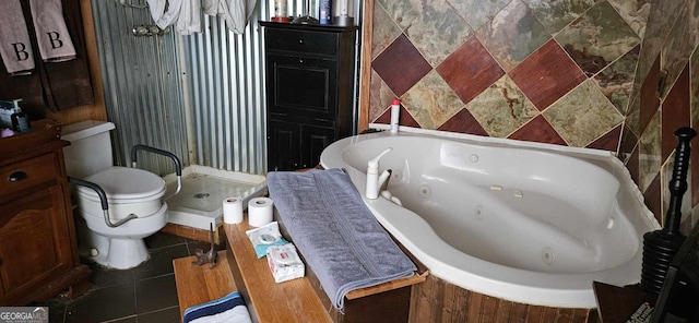 bathroom featuring tile patterned floors, toilet, and a washtub