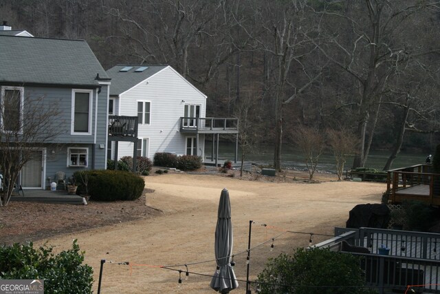 view of yard featuring a balcony