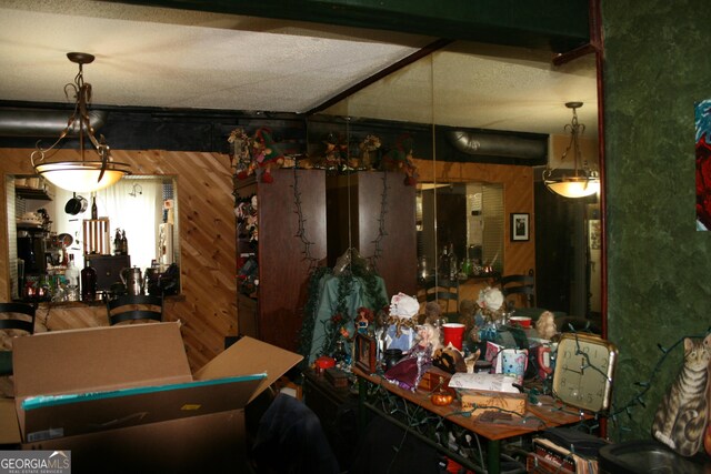 dining room featuring wood walls