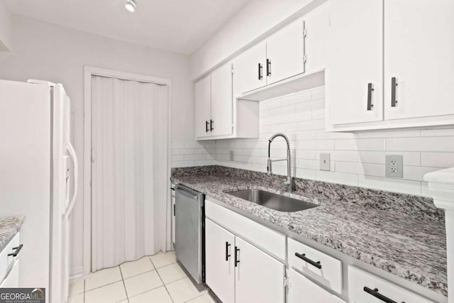 kitchen featuring dishwasher, white cabinetry, sink, decorative backsplash, and white refrigerator