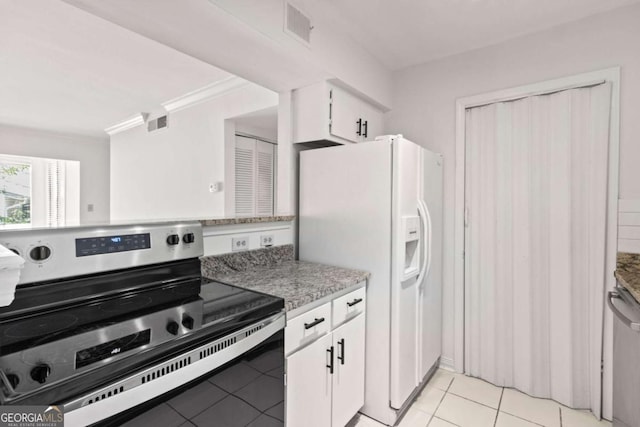 kitchen featuring stainless steel appliances, white cabinetry, ornamental molding, and light tile patterned floors