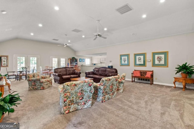 living room with lofted ceiling, light carpet, ceiling fan, and french doors