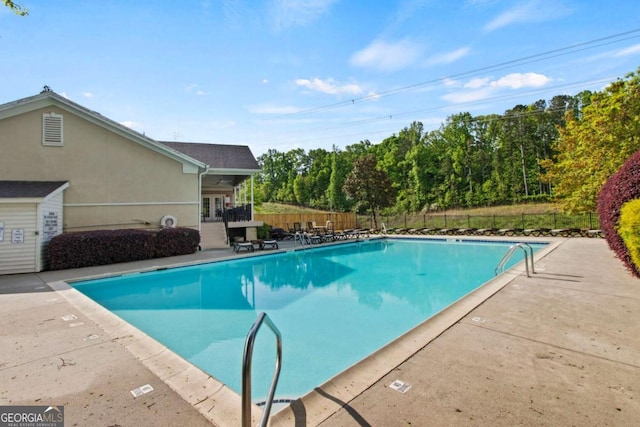 view of swimming pool featuring a patio